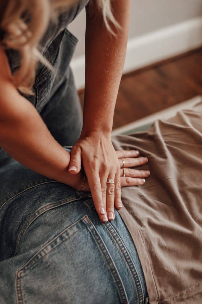 Chiropractor performing spinal adjustment on a patient in a holistic wellness center, emphasizing personalized care and proactive health solutions.